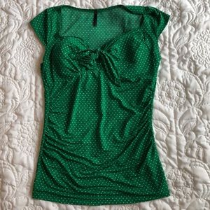 Green and white polka dot cap sleeved blouse